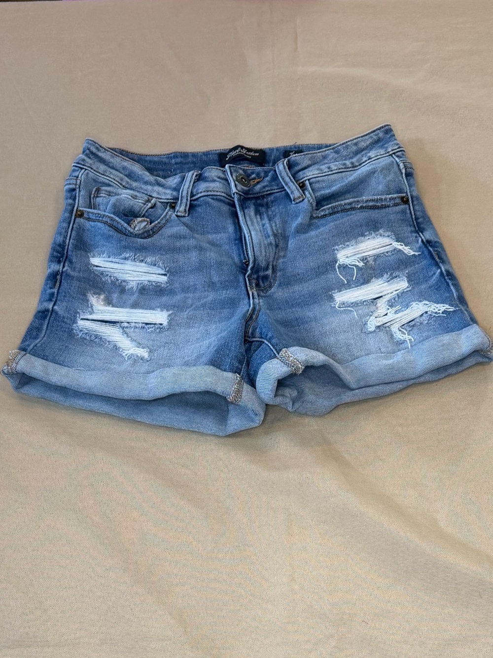 Women’s Light Blue Distressed Denim Rolled-Hem Shorts